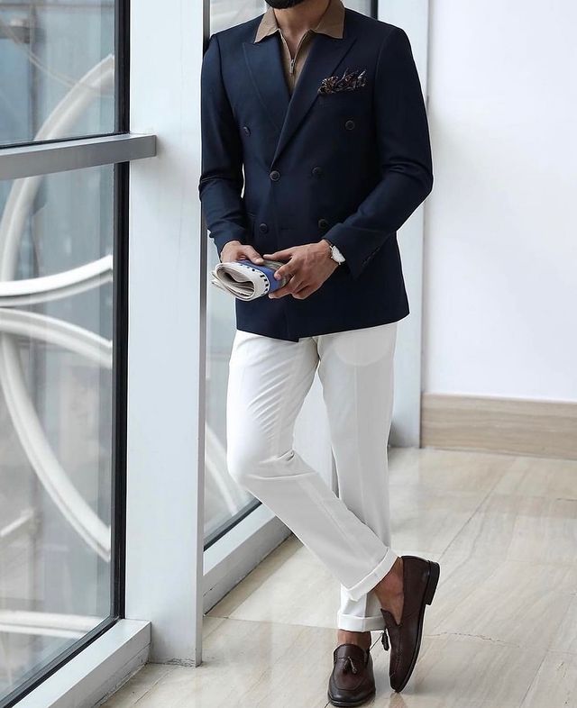 man Wearing Dark Blue Single Breasted Jacket with White Pants