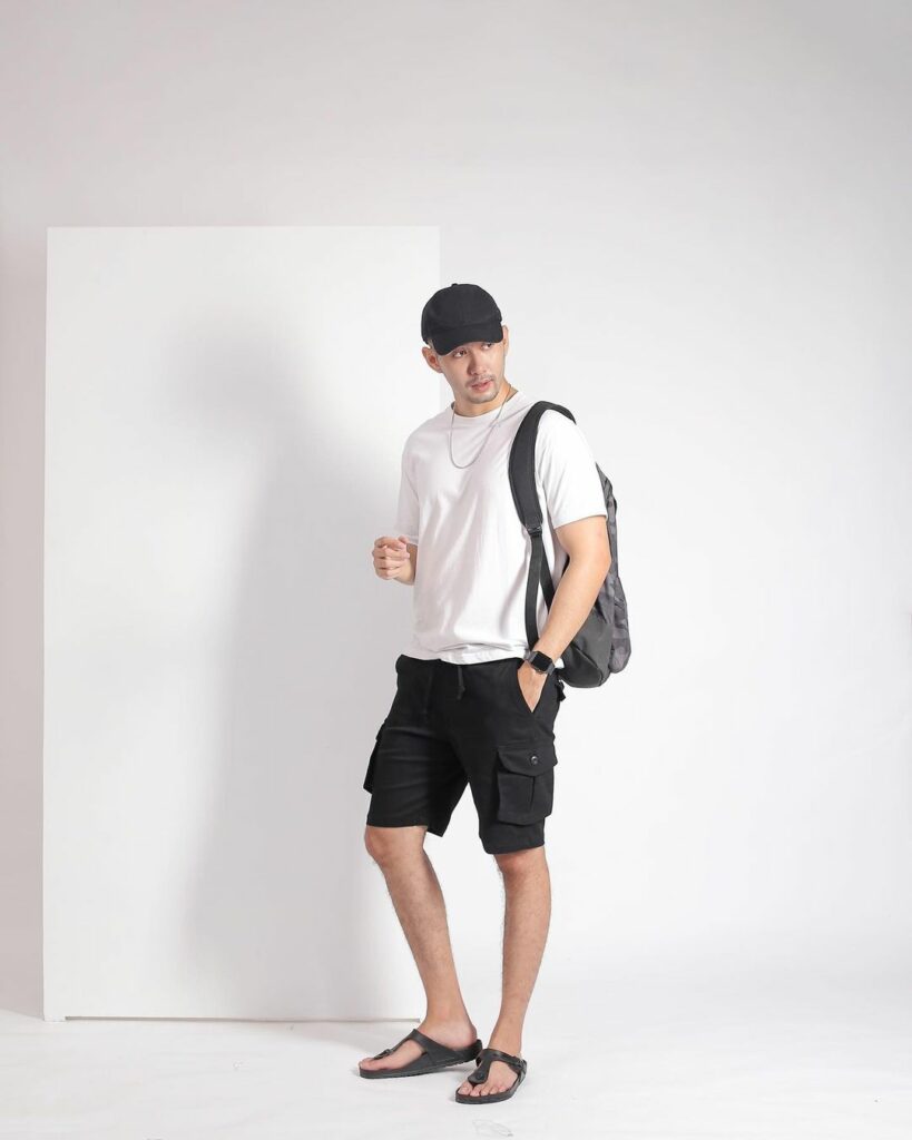man with backpacks and cargo shorts