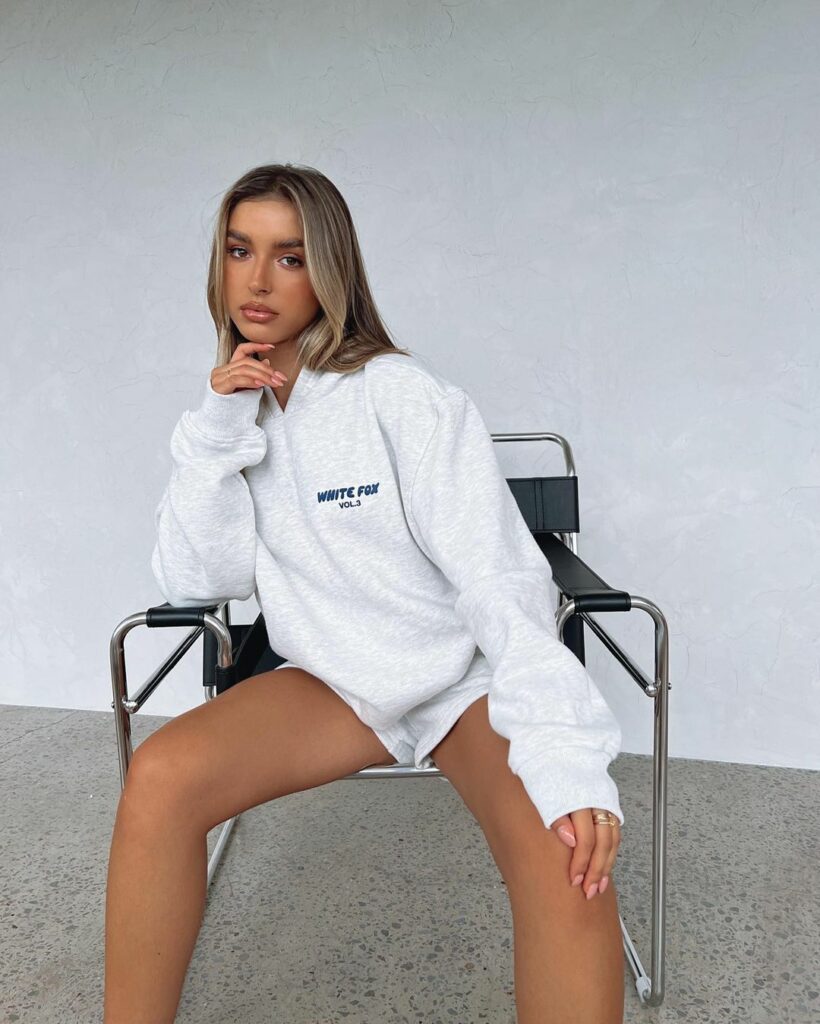 woman wearing hoodie with white shorts