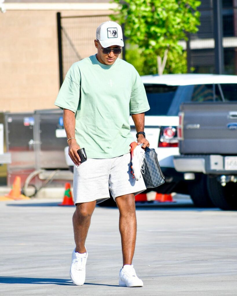 man wearing sneakers and white shorts