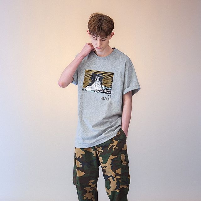 Boy in Casual look with t-shirt and cargo pants