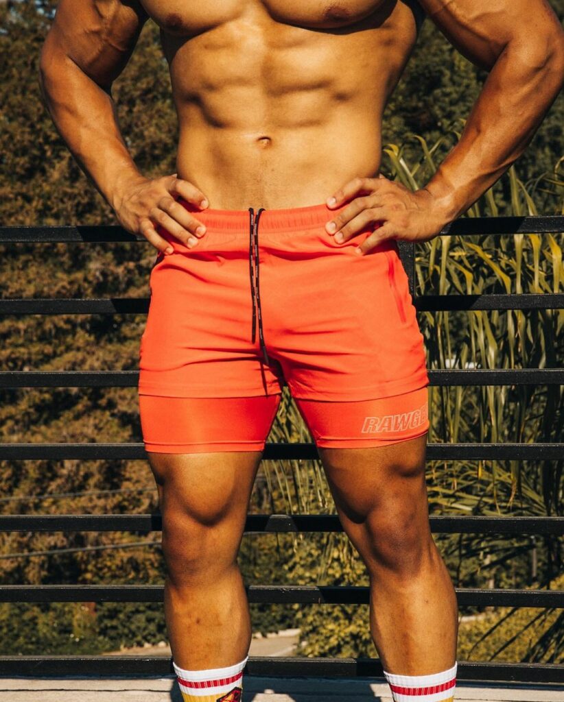 Man wearing orange Compression shorts