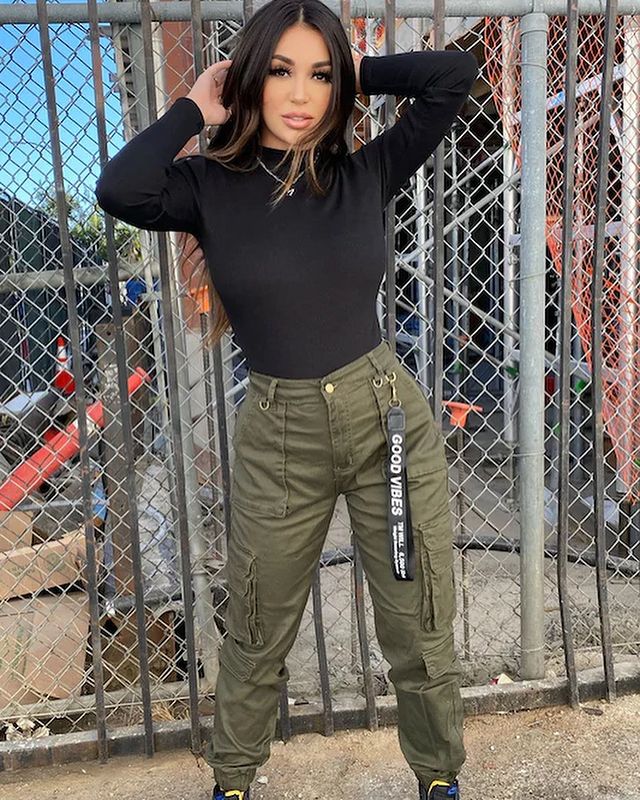 woman wearing Statement Jewelry with cargo pants