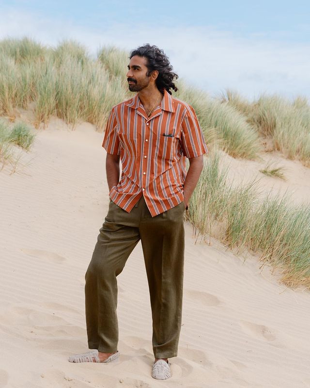 man wearing linen pants with half sleeve shirt