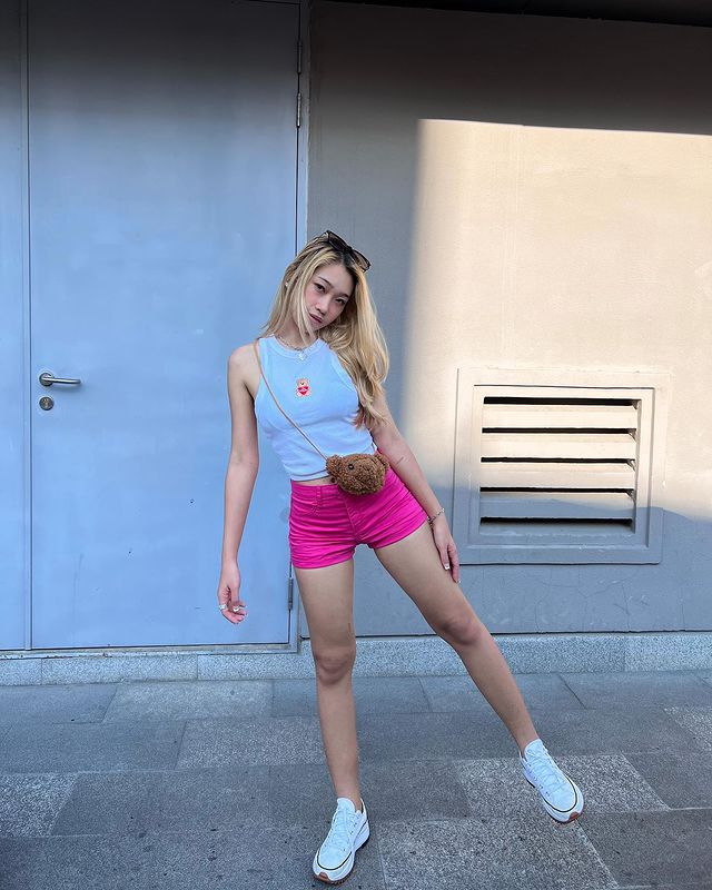 Girl wearing pink shorts with blue tops