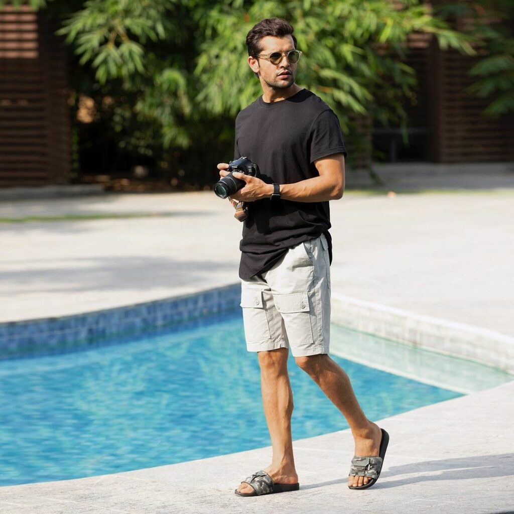 man wearing sandals with cargo shorts