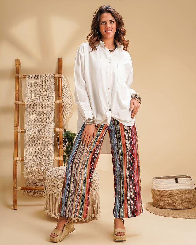 woman wearing wide-leg trousers with white shirt