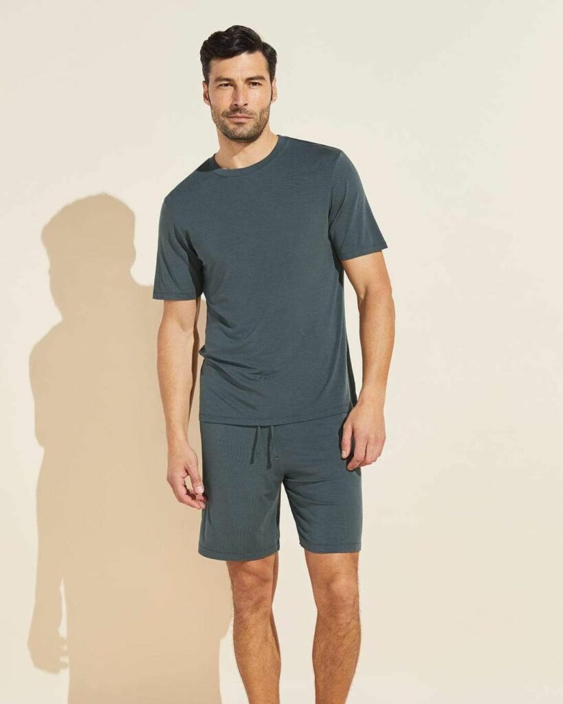 A man wearing olive color Crew Neck T-Shirts with shorts