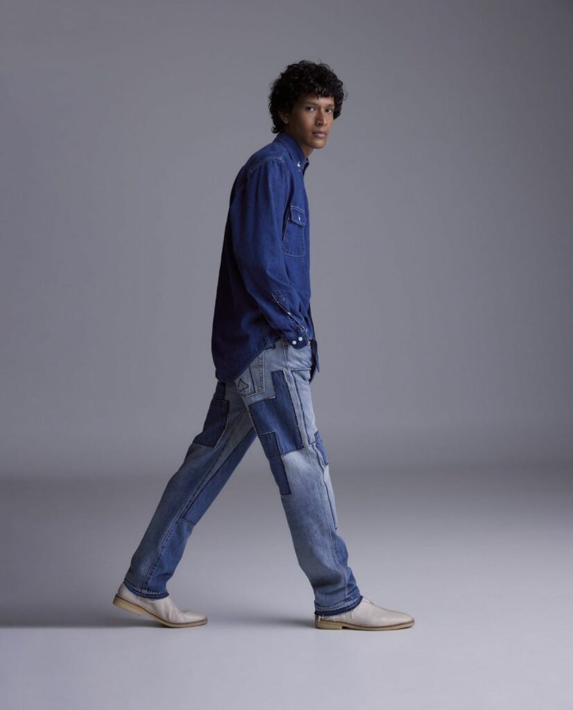 simple denim shirt with a pair of straight-leg jeans